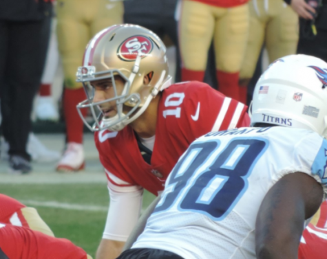49ers Quarterback Jimmy Garoppolo lines up under center to take the snap.