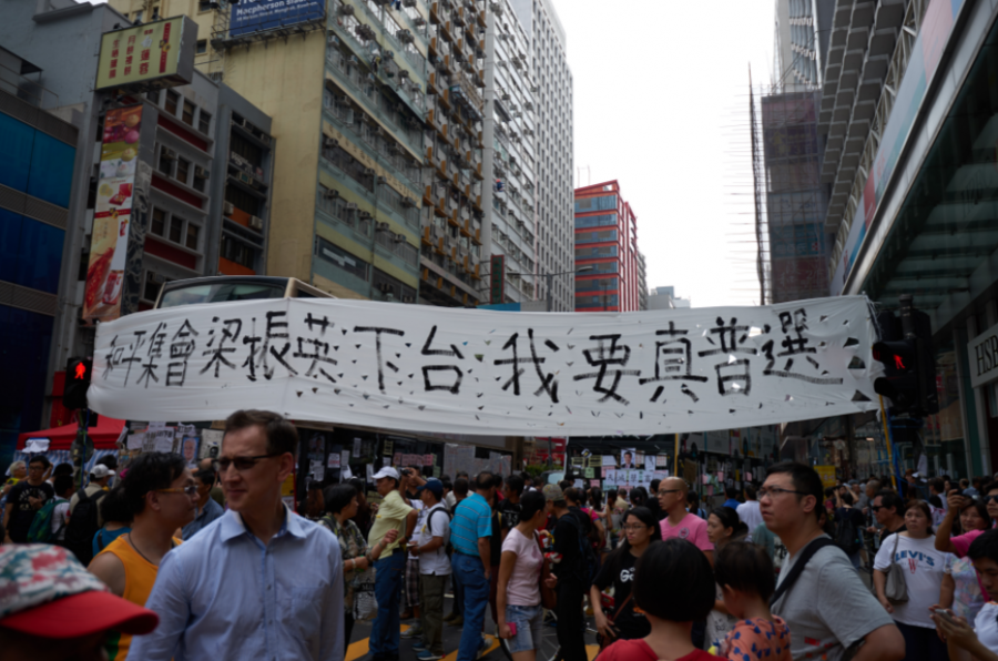 Hong+Kong+protesters+on+the+streets.+The+banner+reads%2CPeaceful+gathering%2C+CY+Leung+steps+down%2C+I+want+true+universal+suffrage.