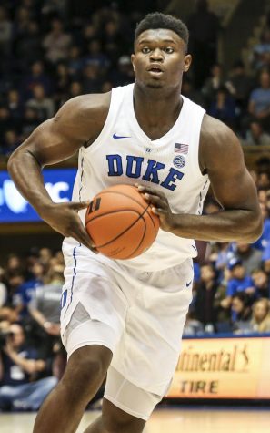 Zion Williamson looks to pass in a Duke exhibition game. Prominent players like him will be able to secure endorsements in college. 