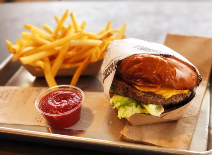 A picture of the Impossible Burger, distributed by Burger King. It is a completely vegan burger priced at $7. 