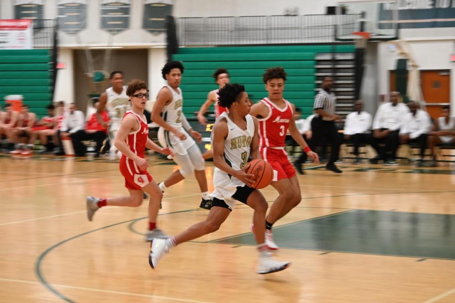 Junior Jake Watkins drives to the hoop against Munroe.