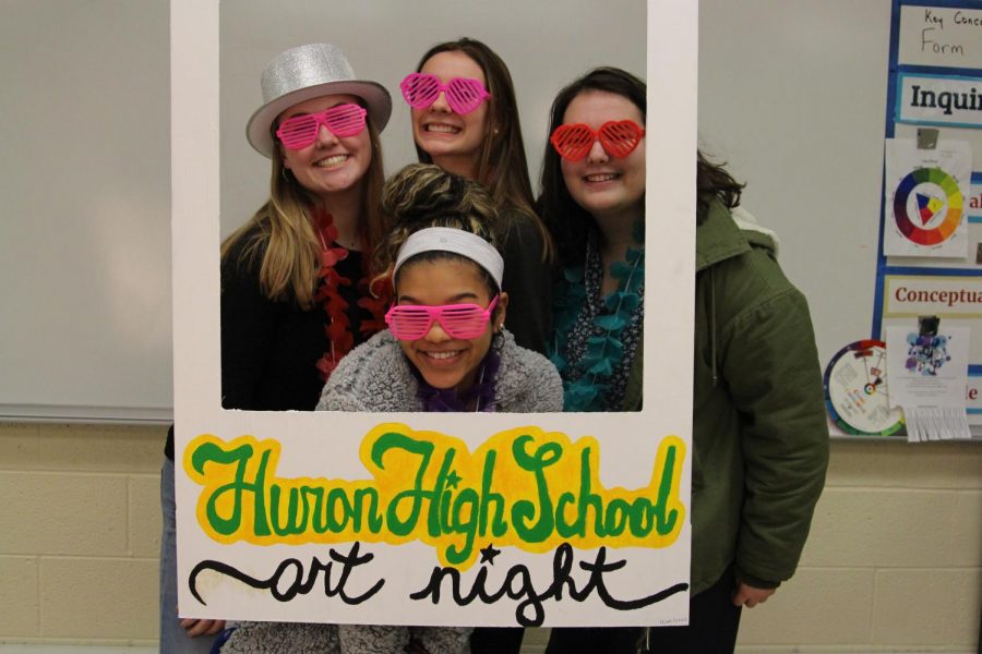 Juniors Kristin Thorsdottir, Abby Jelic, Payton Bristol and Elena Kaul dress up in costumes in Art Nights photo booth. 