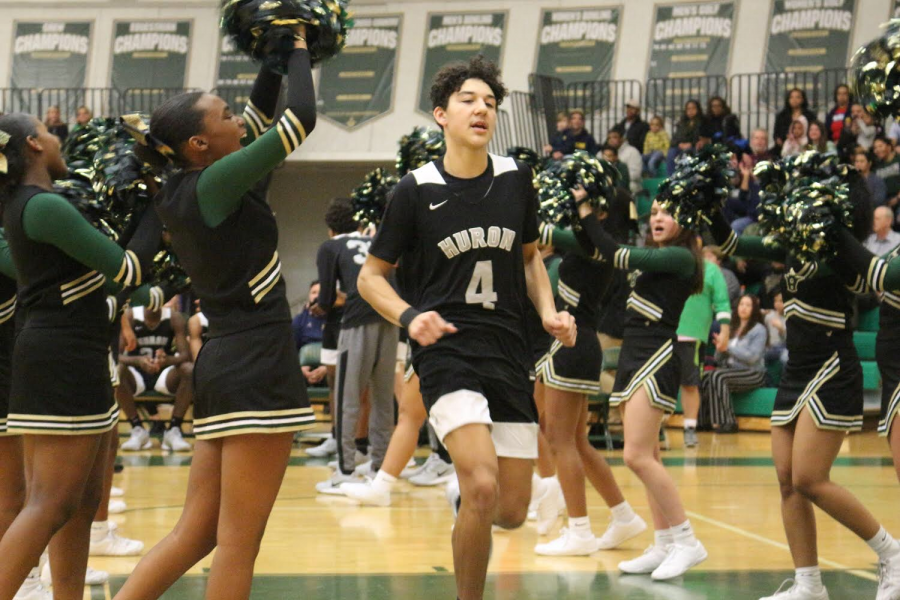 Junior Tyson Edmonson jogs onto the court prior to the Huron vs. Pioneer showdown