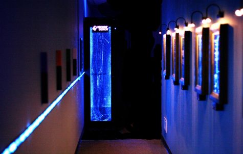 A lit blue pathway located at the entrance of Decode Detroit.