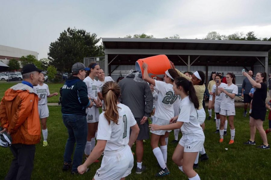 Jadyn Smith showers Coach Lee Hudson with Gatorade shortly after the district final win against Skyline. 