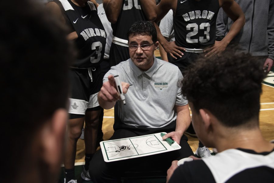 Ann Arbor Huron head coach Waleed Samaha coaches his team between quarters during the game against Ypsilanti Lincoln at the EMU Convocation Center on Tuesday, March 3, 2020.