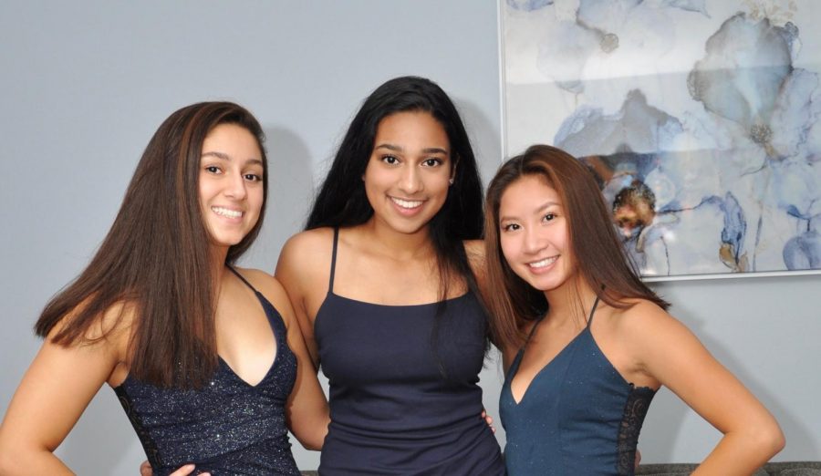 Pooja (middle) and her friends at homecoming. 