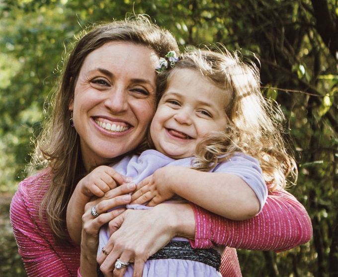 Emily Mashal hugging her daughter Liana.