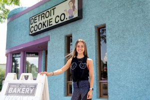 Owner Lauren Roumayah stands in front of the Detroit Cookie Company store in Ferndale. Recently, the second location in Ann Arbor opened.