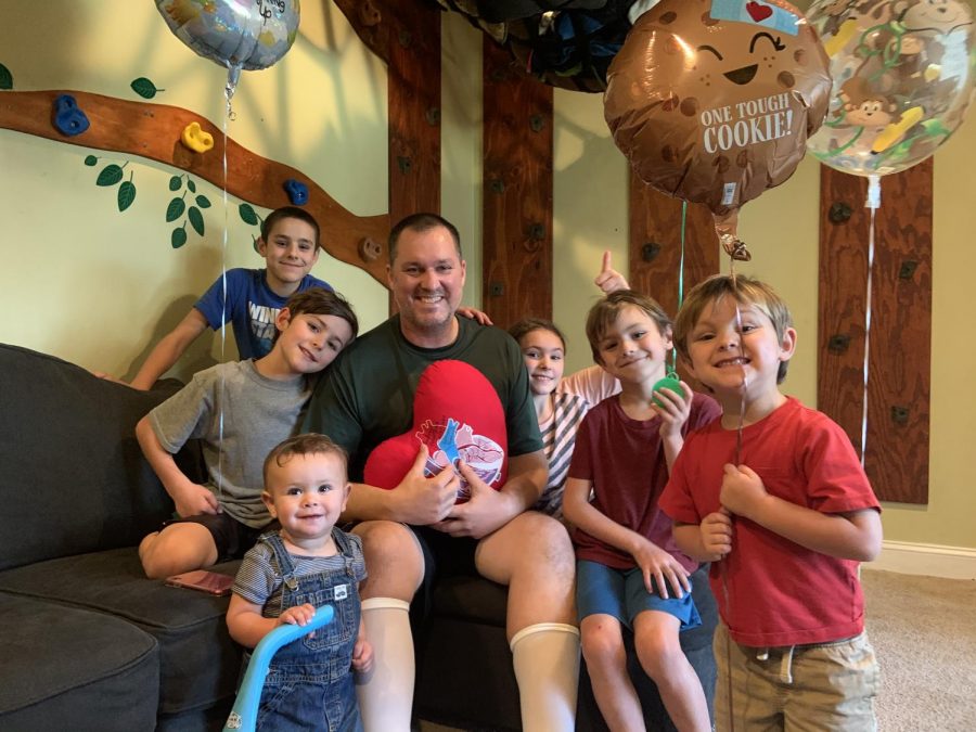 Sumertons family celebrates his successful open heart surgery. In Sumertons arms is the pillow depicting the process of the Ross procedure, where the malfunctioning aortic valve is replaced by the pulmonary one.