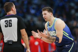 Dallas Mavericks forward Luka Doncic (77) disputes a call by referee David Jones (36) during the first half against the Sacramento Kings on Sunday, Dec. 8, 2019 at American Airlines Center in Dallas, Texas. (Ryan Michalesko/The Dallas Morning News/TNS)