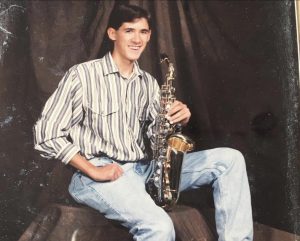 Robert Fox poses in his senior photo with his beloved saxophone.
