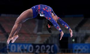 U.S. gymnast Simone Biles competes on the beam in the womens team qualifying at the 2020 Tokyo Olympics on Sunday, July 25, 2021. She withdrew days later, citing her mental health. 