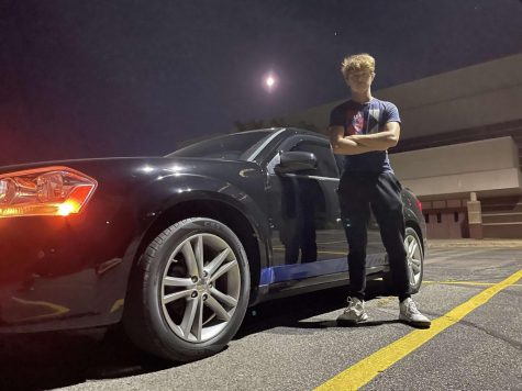 Brayden Yannone poses next to his car, which he also refers to as his prized possession.