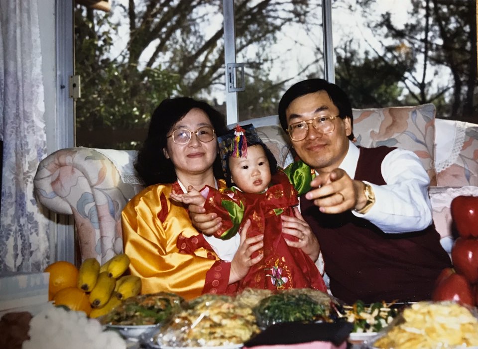 Joyce Lee, who just turned 1 years old, and her parents in their Davis, California house.