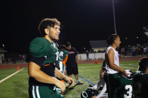 Leo Nicio celebrating after winning a football game against rivals Ann Arbor Pioneer.
