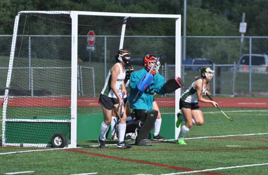 Bennet Flying to the ball during field hockey penalty corner.