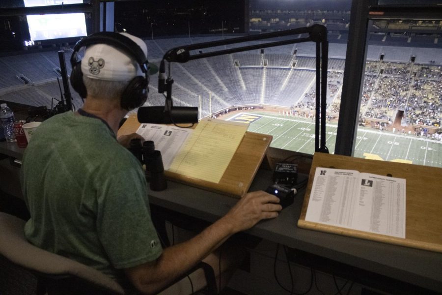 Carmen DiFranco watches The Battle at the Big House from the broadcasting booth. As a teacher at Huron High School, and now an announcer at the Big House, DiFranco was overjoyed with this opportunity.