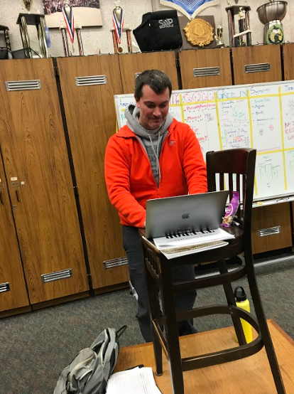 Rodriguez prepares for his next class in the band room. 