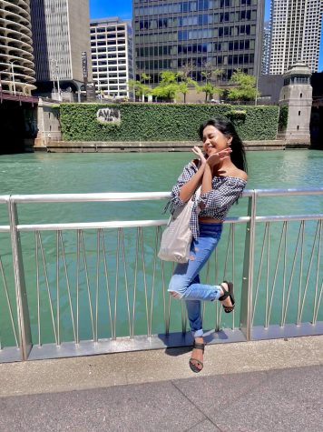 Joys Kapali posing by the Chicago Riverwalk, not a single clue if she will find a job after graduation or not. She does.