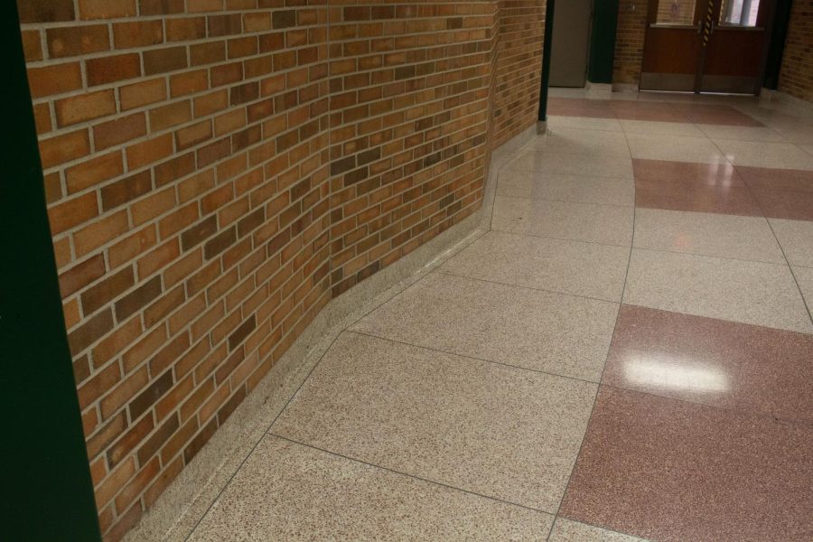 Outside of Meyers auditorium, the brick walls surrounding the auditorium were designed in a zigzag pattern. The hallway where the main entrance to Meyers is curved, and the zigzag walls help to hide that. They also frame the entrance to the auditorium. Like the wood paneling, the zigzag walls also help to invite people into Meyers. With both of these design features leading people into Meyers auditorium, even just the entrance to the auditorium is memorable.