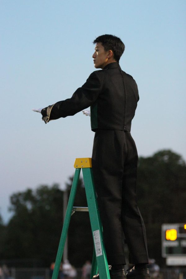 Junior Nathan Leung is saxophonist and drum major at Huron band.