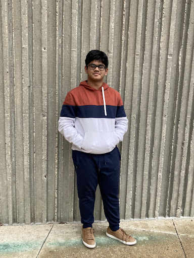 Rudradip Ray, standing proudly in front of the foundations of Huron High School.