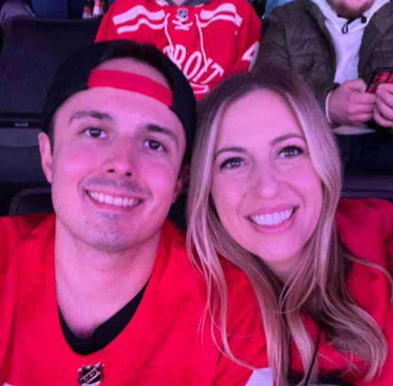 Weir and her husband watching the Detroit Red Wings at Little Caesars Arena.