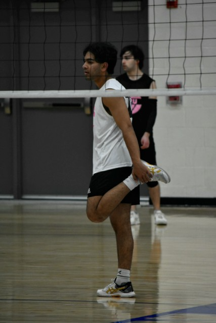 Alam stretching before a volleyball game.
