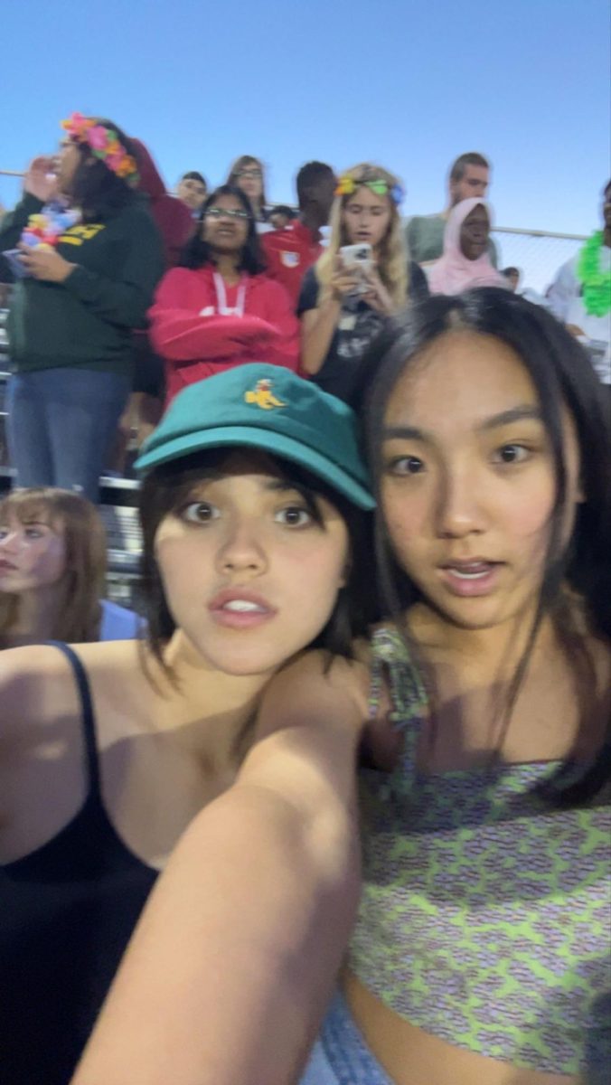 Meath (left) with a friend at a football game. Photo courtesy of Meath. 