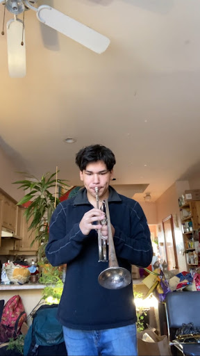 Bagchi practicing the trumpet in his house