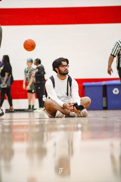 Zain Charania takes pictures at The D Zone Shootout in Dearborn, Michigan in June, 2023. Photo by Toby Krupsky. 
