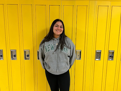 Campbell posing in front of the lockers at Huron. Photo courtesy of Campbell