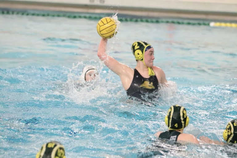 Senior Mada Montgomery throws the winning ball over the net. Photo courtesy of Montgomery.