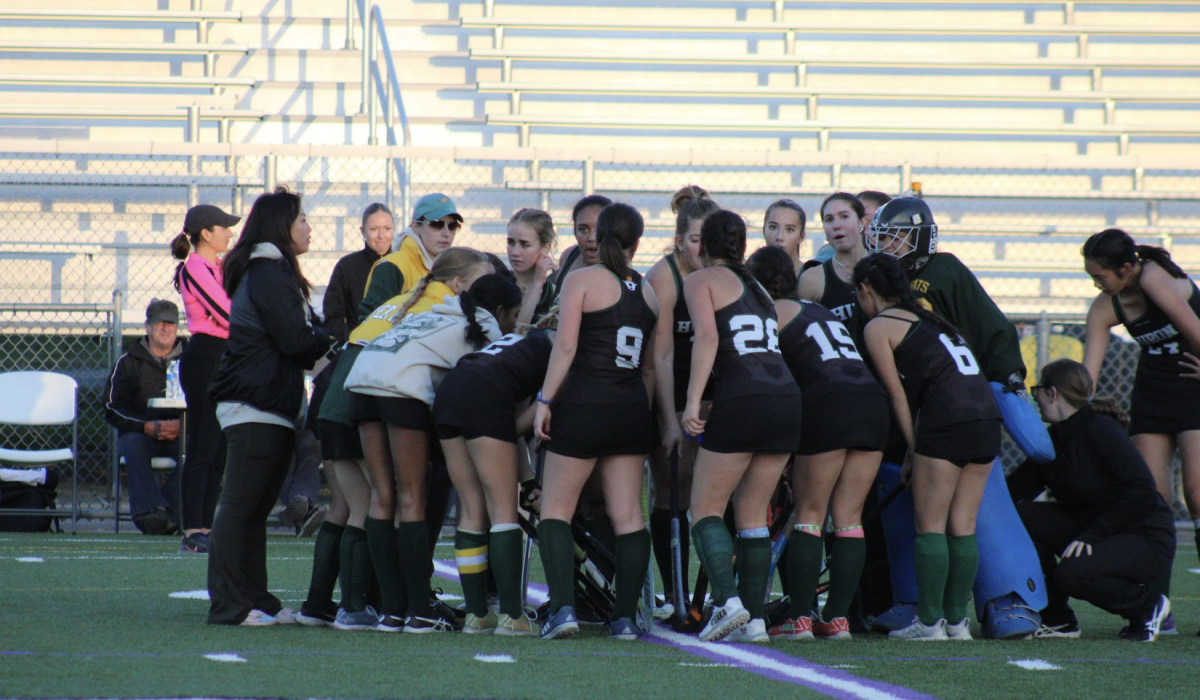 The Huron Field Hockey team prepares for their semi-final game against Pioneer.