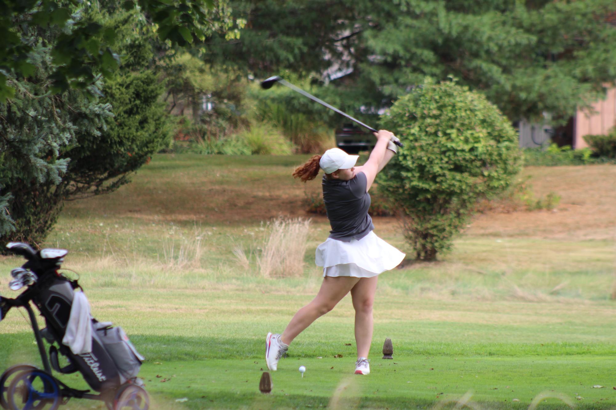 Baidel takes a swing at the tee box. (Photo courtesy of the Huron Girls' Golf Team)