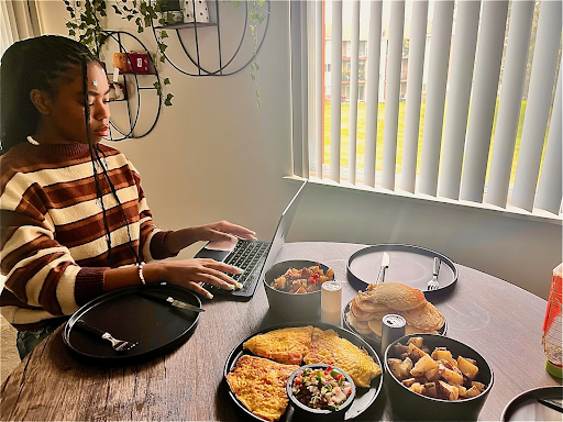 At her older sister’s house, Pryor is doing homework while during breakfast. Photo courtesy by Pryor.