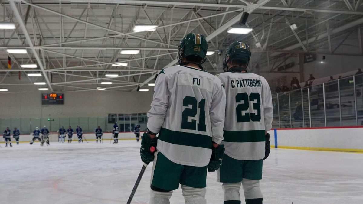 Kyle Fu and Caleb Patterson on the ice together.