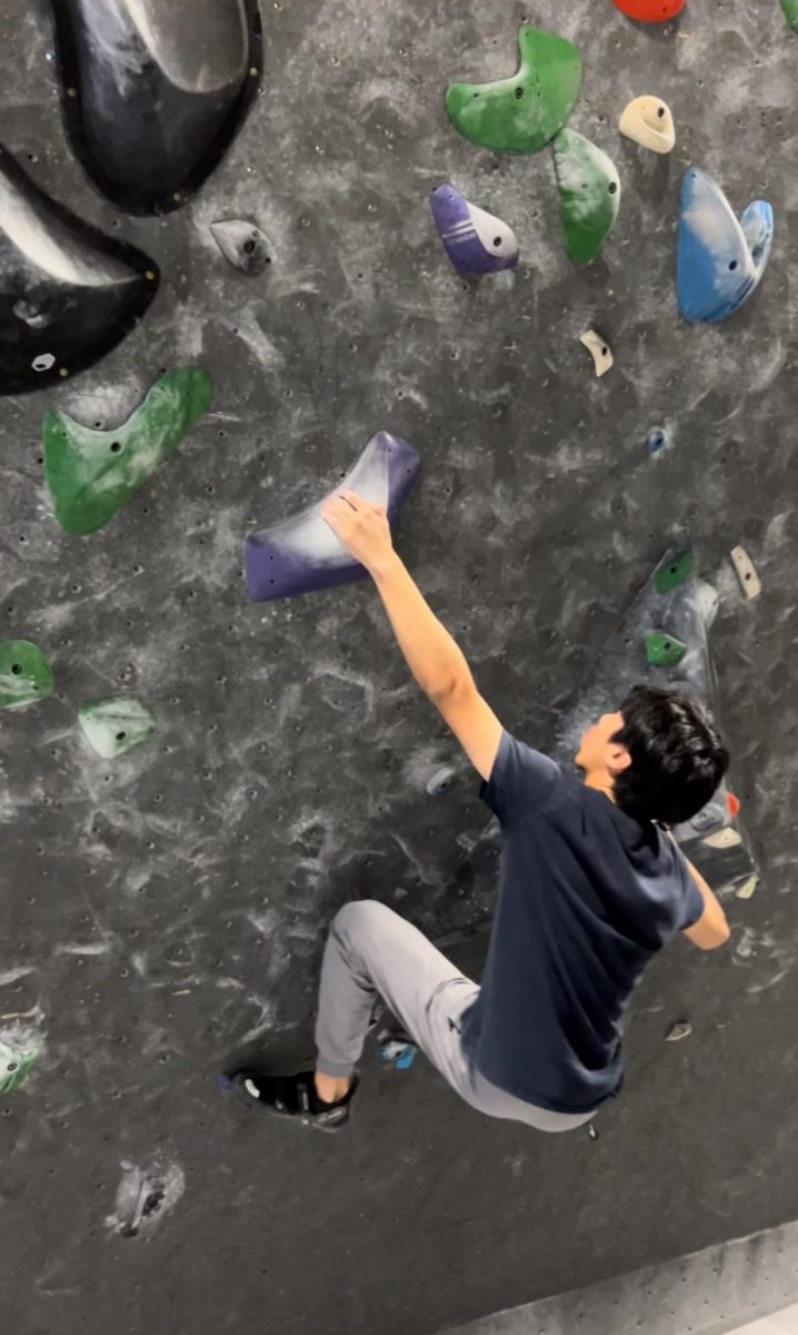 Tchun scales new heights with his passion for rock climbing. Photo courtesy of Tchun