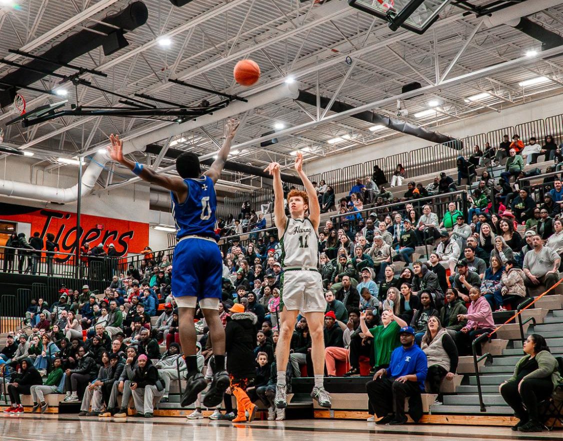 Keefer attempts a three-point shot to tie the game up early in the first quarter of the game.  Keefer made this three-pointer and went on to score 11 total points.