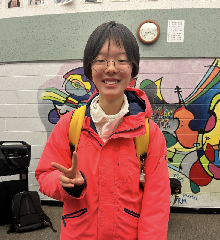 Jayeun Lee posing with her North Face jacket.