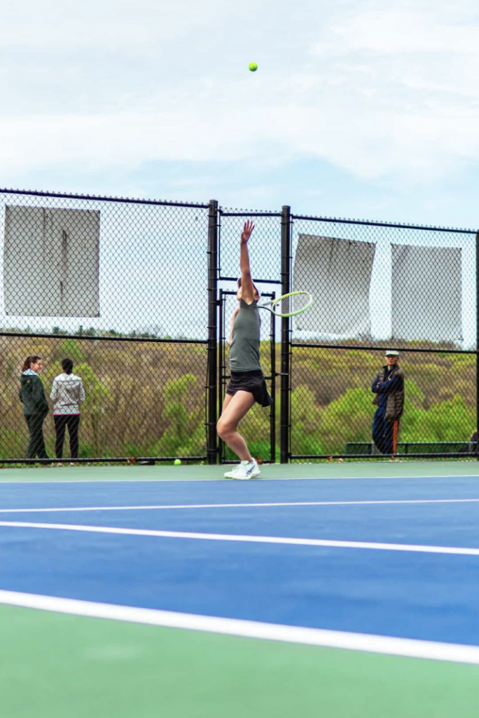 Senior Serena Chang serves the ball for the win.