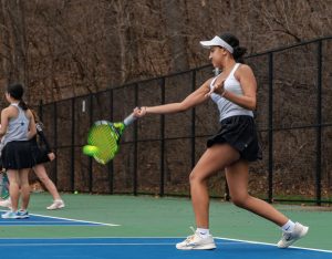 Jadhav making contact with the ball during a forehand during practice.
