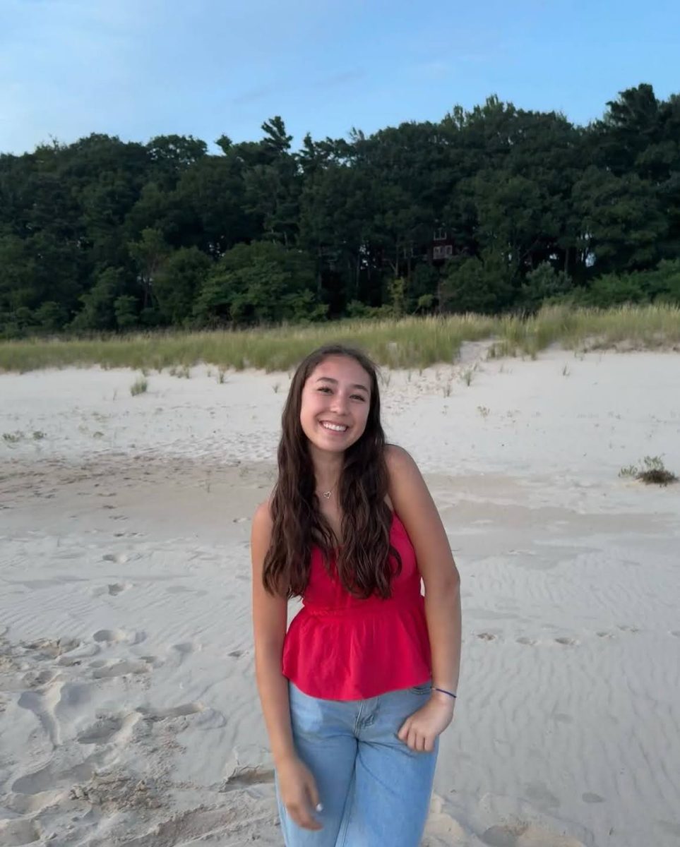 Emmi Conrad posing for a photo at the beach. Courtesy of Conrad.