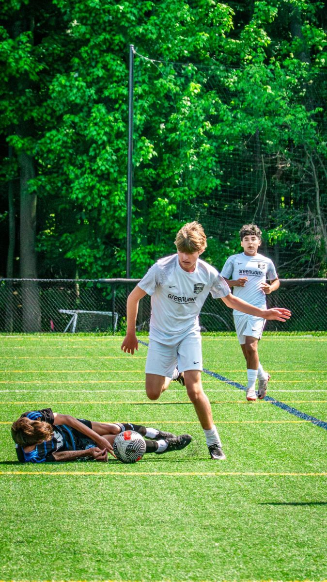 Heskia keeps his eyes on the ball and runs to it after fouling an opponent.
