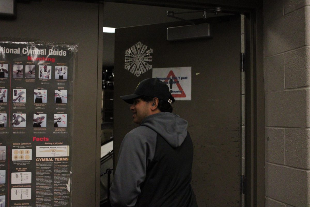 Chavarkar entering the specialized Percussion room with all the equipment and instruments.