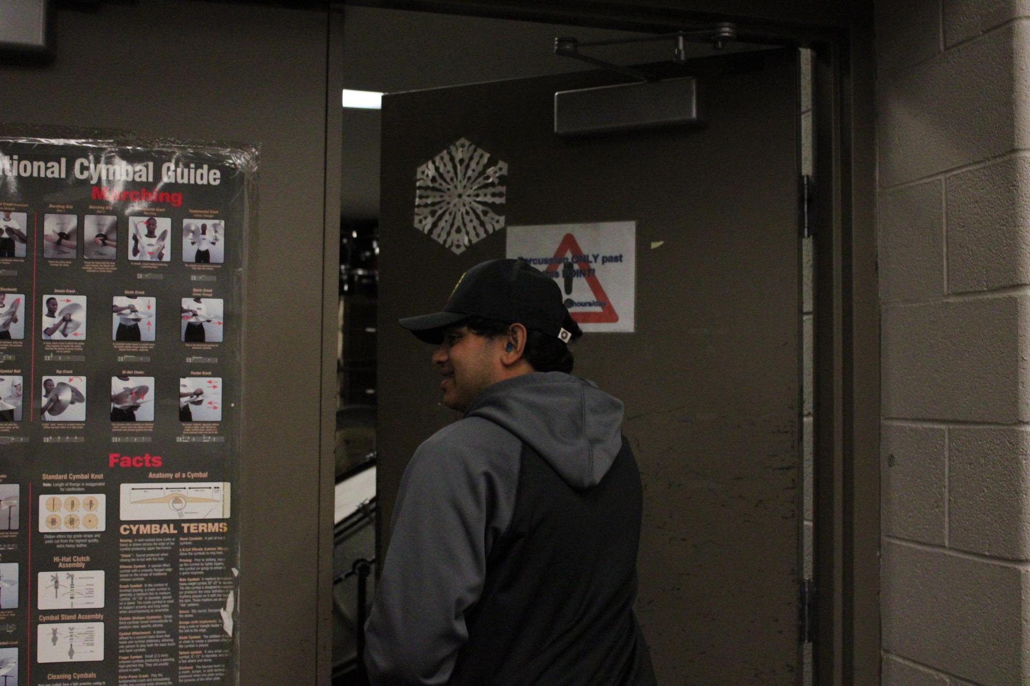 Chavarkar entering the specialized Percussion room with all the equipment and instruments.