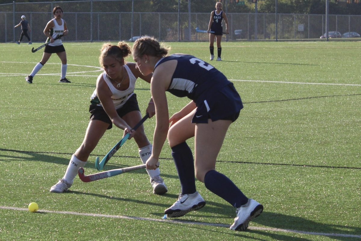 Freshman Kennedy Gayles attempts to clear the ball out to allow the midfielders to take the ball up the field.