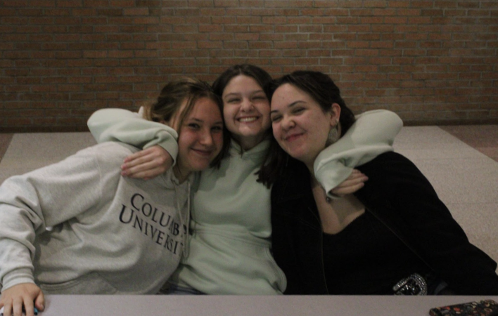 Seniors Bea Harss, Charlotte Picton, and Vi Diem like that their table by the library is quiet. Picton added, “There’s art. It’s nice to look at.” (Grace Johnson)