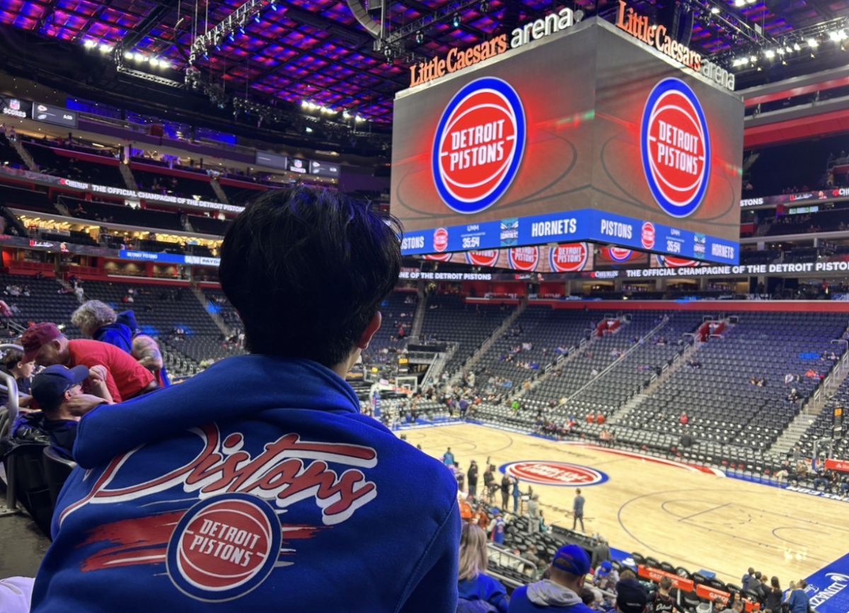 Ivan Wu attending the basketball game at Little Caesars arena.